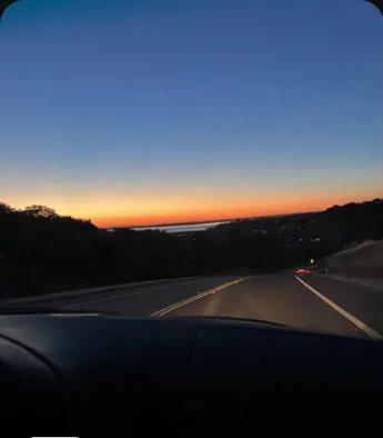 Road at dusk with a glowing horizon