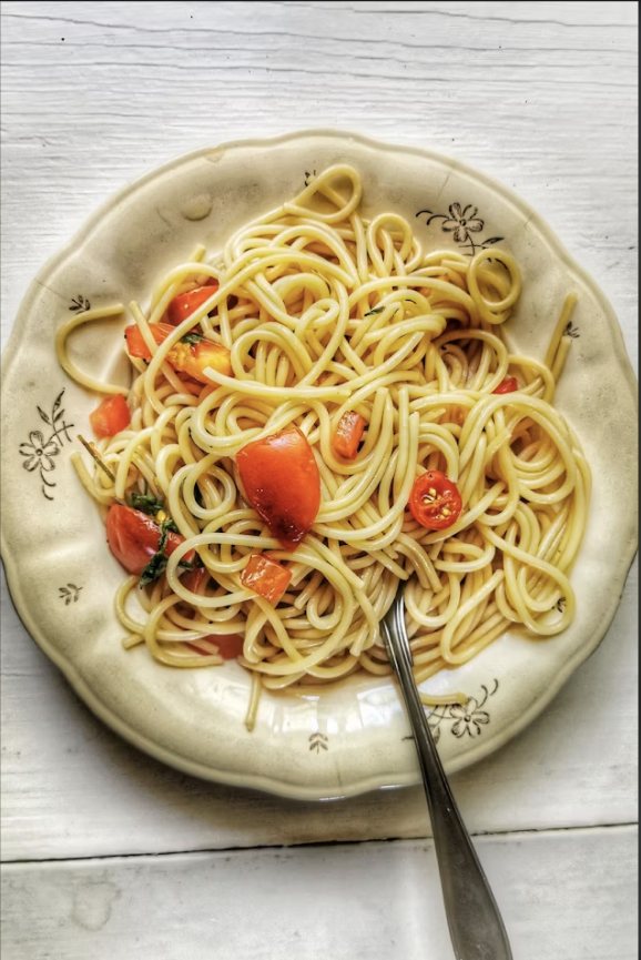 Plate of spaghetti with tomatoes