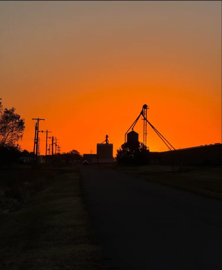 Silhouette of a grain elevator against an orange sunset, posted to the Photo Diary topic